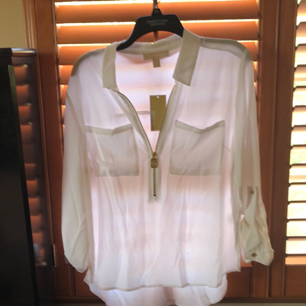 a new white michael kors blouse